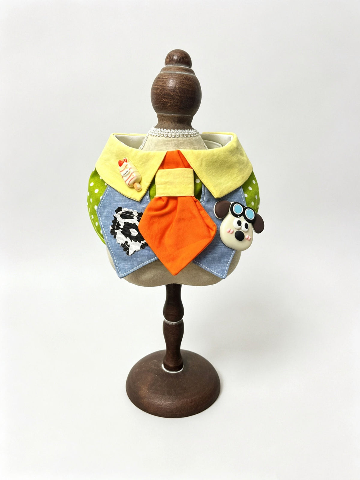 Yellow collar bib with orange tie