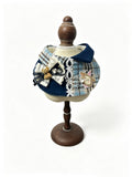 Navy and blue plaid bib with teddy bear and lace