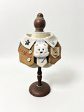 Brown vest bib with fluffy white puppy patch